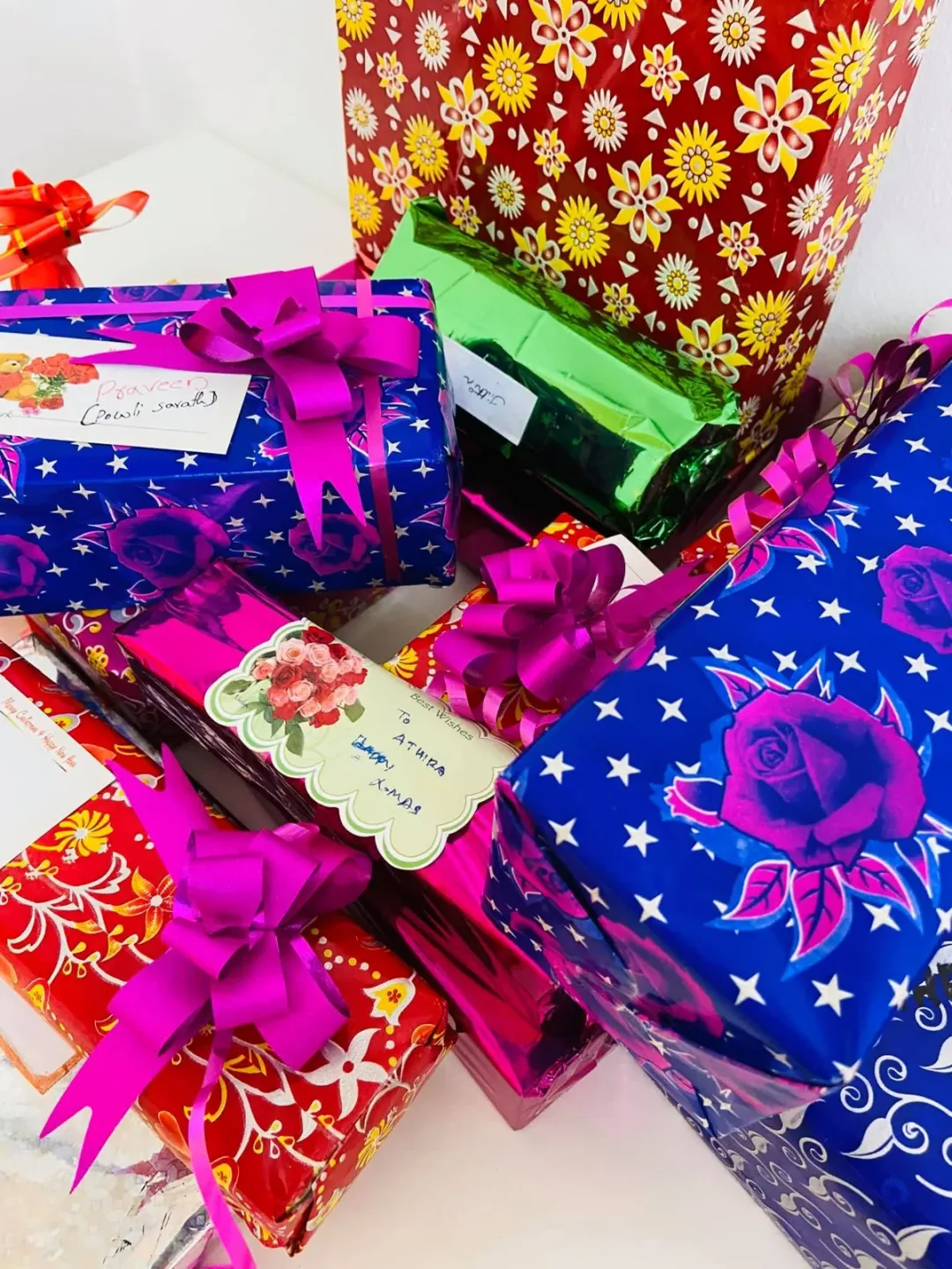 A pile of wrapped Christmas gifts