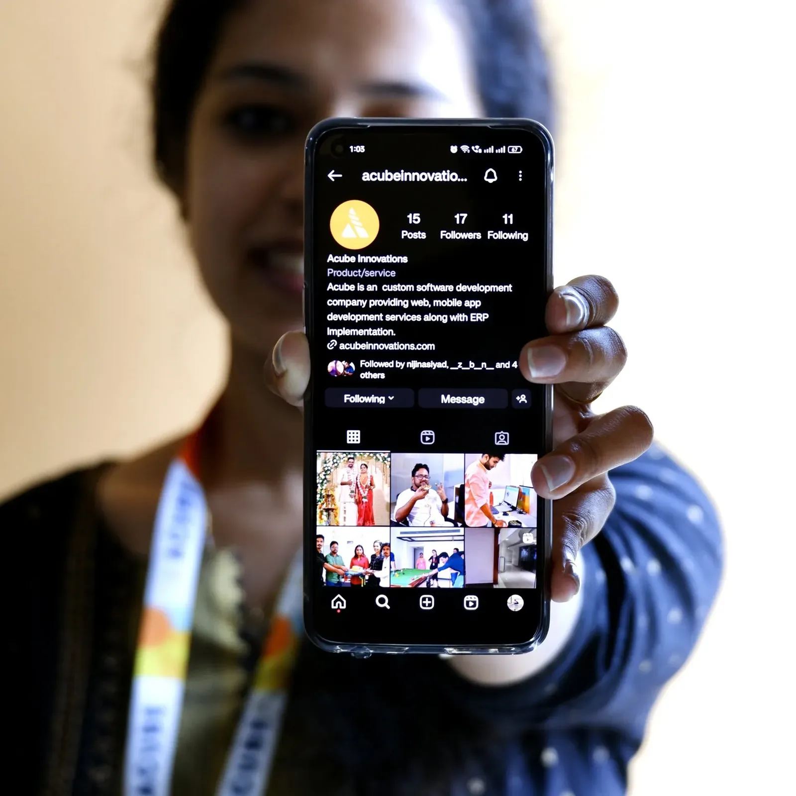 A phone showing Acube's Instagram profile